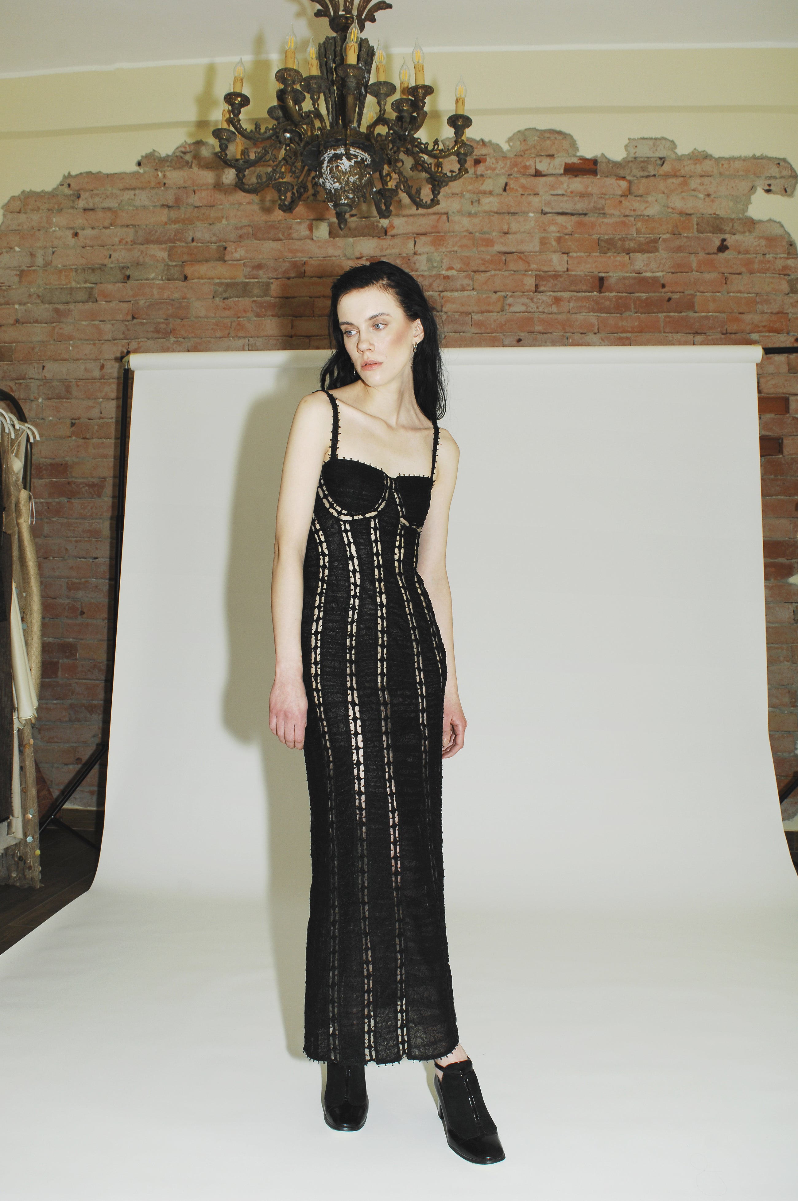 Stylish black cocktail dress for women with off-shoulder design and fashion-forward details.