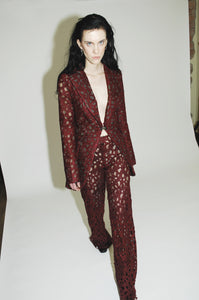 Tailored jacked with ensemble featuring a heart-inspired textile on the jacket and pants
