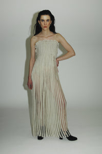 "Love Remains" dress - Rouba G's stunning handwoven maxi dress, symbolizing love's resilience and beauty, with intricate mosaic-like design and a sophisticated corseted upper.