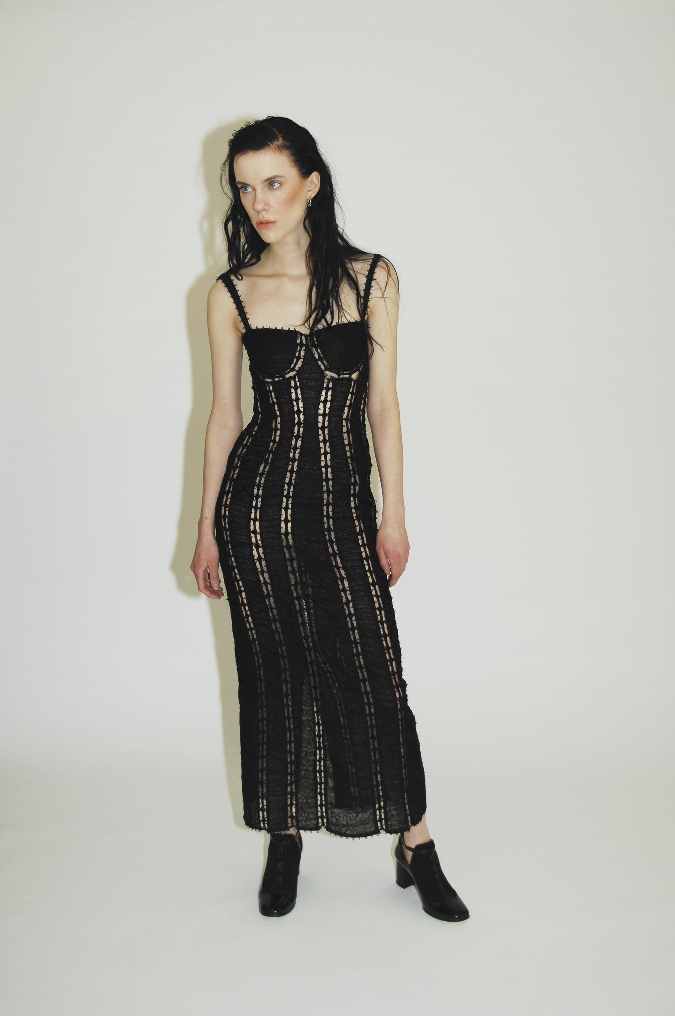 Stylish black cocktail dress for women with off-shoulder design and fashion-forward details.