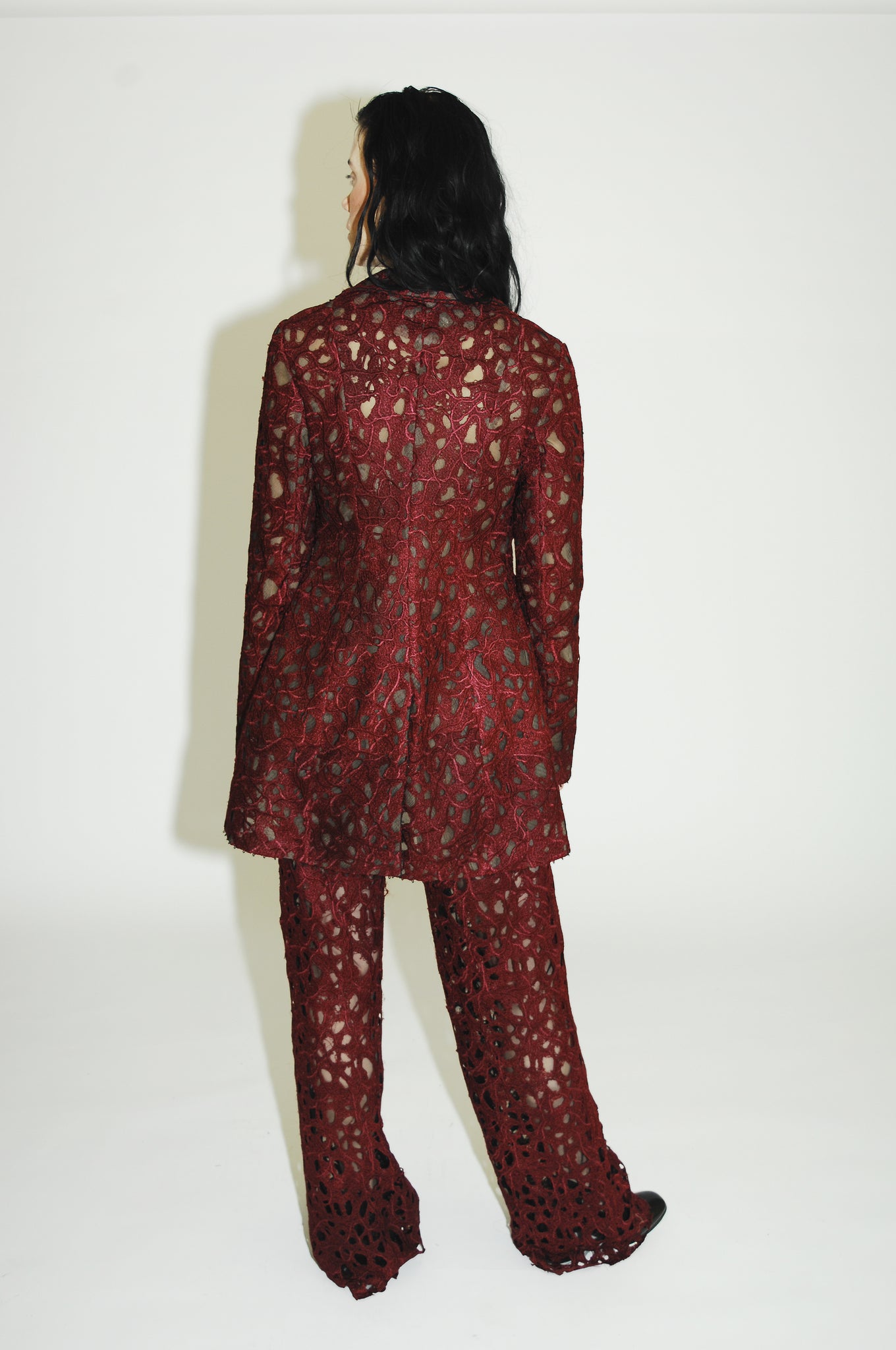 Tailored jacked with ensemble featuring a heart-inspired textile on the jacket and pants