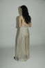 "Love Remains" dress - Rouba G's stunning handwoven maxi dress, symbolizing love's resilience and beauty, with intricate mosaic-like design and a sophisticated corseted upper.