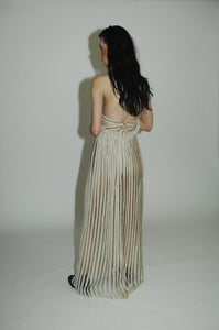 "Love Remains" dress - Rouba G's stunning handwoven maxi dress, symbolizing love's resilience and beauty, with intricate mosaic-like design and a sophisticated corseted upper.