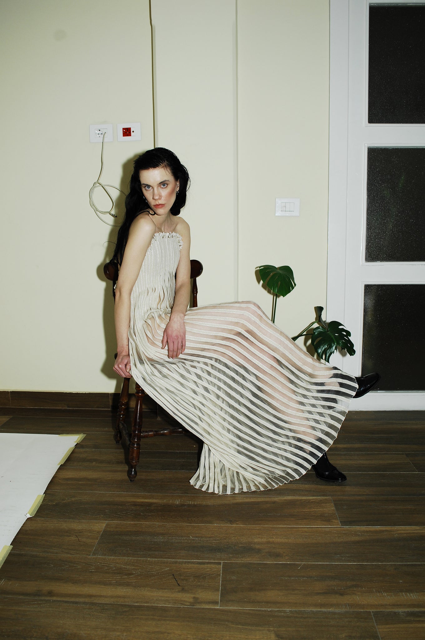 "Love Remains" dress - Rouba G's stunning handwoven maxi dress, symbolizing love's resilience and beauty, with intricate mosaic-like design and a sophisticated corseted upper.