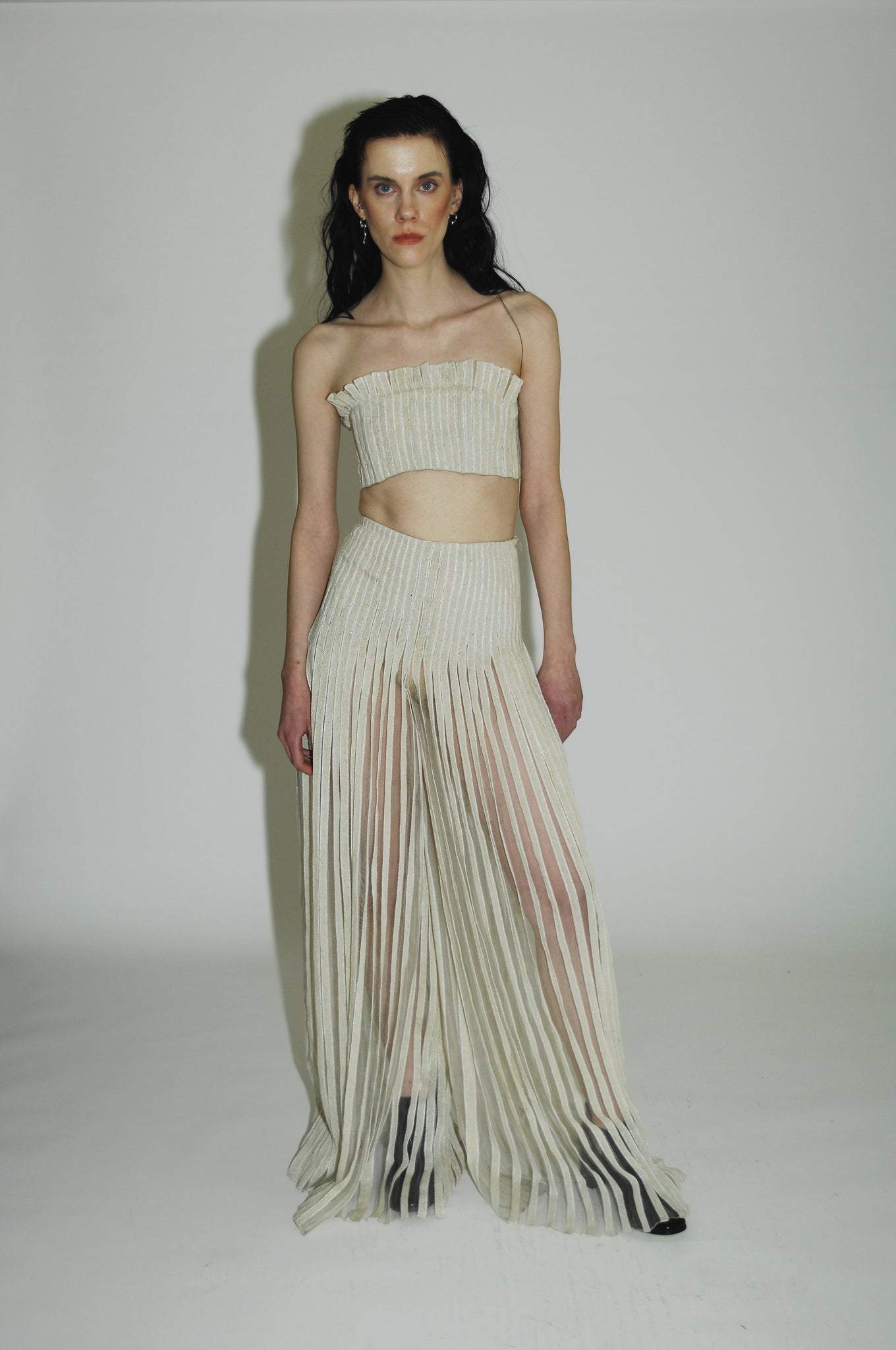 Handwoven silk with intricate ruffle detail, celebrating healing and imperfection