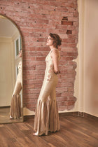 RoubaG's gold-ivory flared pants jumpsuit with honeycomb cuts and open back