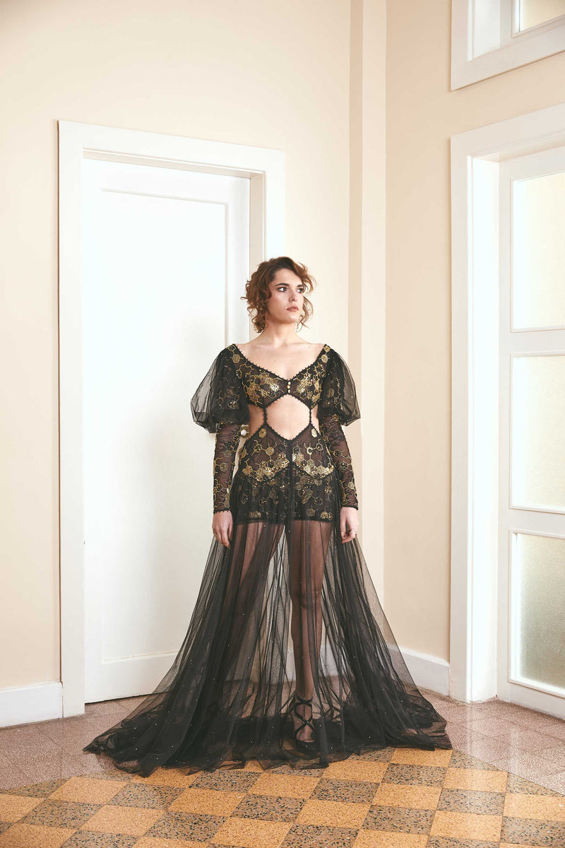 A Black sleeveless maxi dress of celestial beauty from the Love is Okay collection, featuring a handwoven design with Indian embroidery on luxurious Noil silk fabric