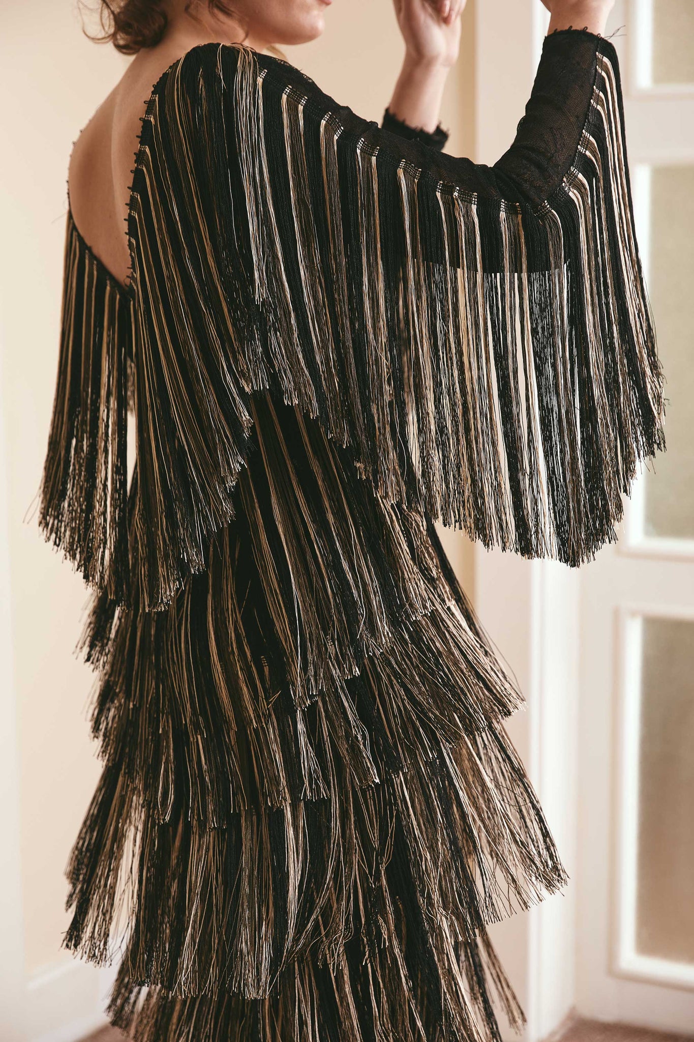 Black full fringe long sleeved lace dress - a fashion-forward statement for parties and events