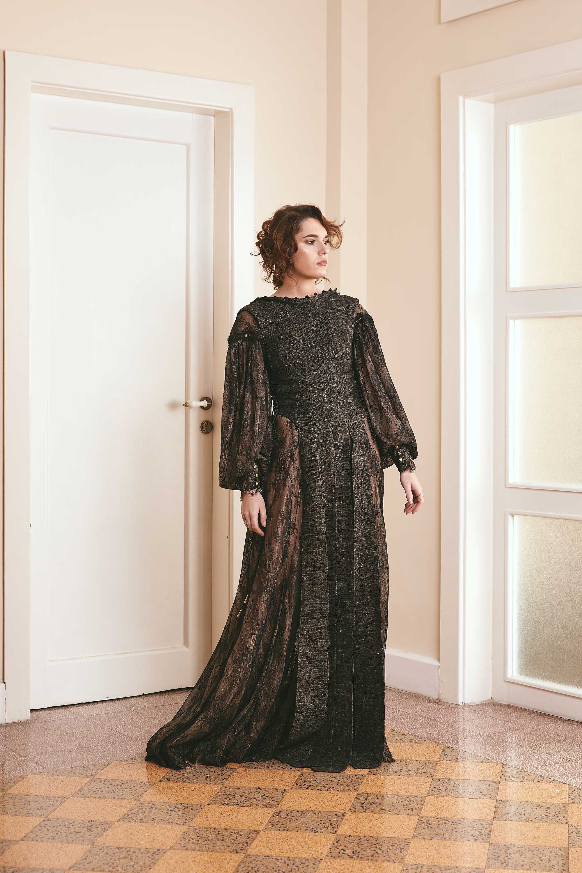 Black two-tone dress made of plain woven silk and lace, with long puffy sleeves and a backless style, ideal for fashion-forward women