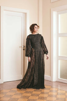 Black two-tone dress made of plain woven silk and lace, with long puffy sleeves and a backless style, ideal for fashion-forward women