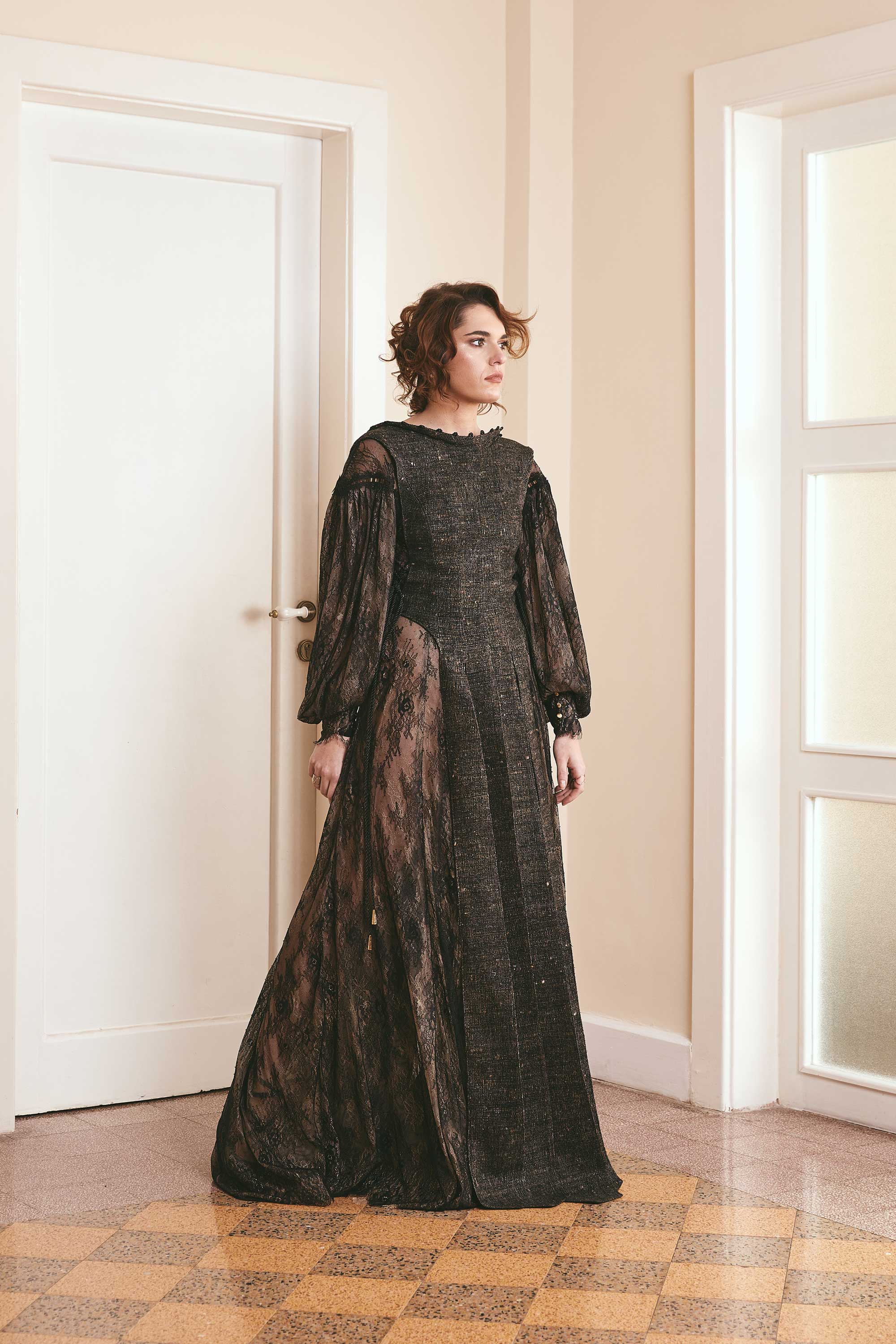 Black two-tone dress made of plain woven silk and lace, with long puffy sleeves and a backless style, ideal for fashion-forward women