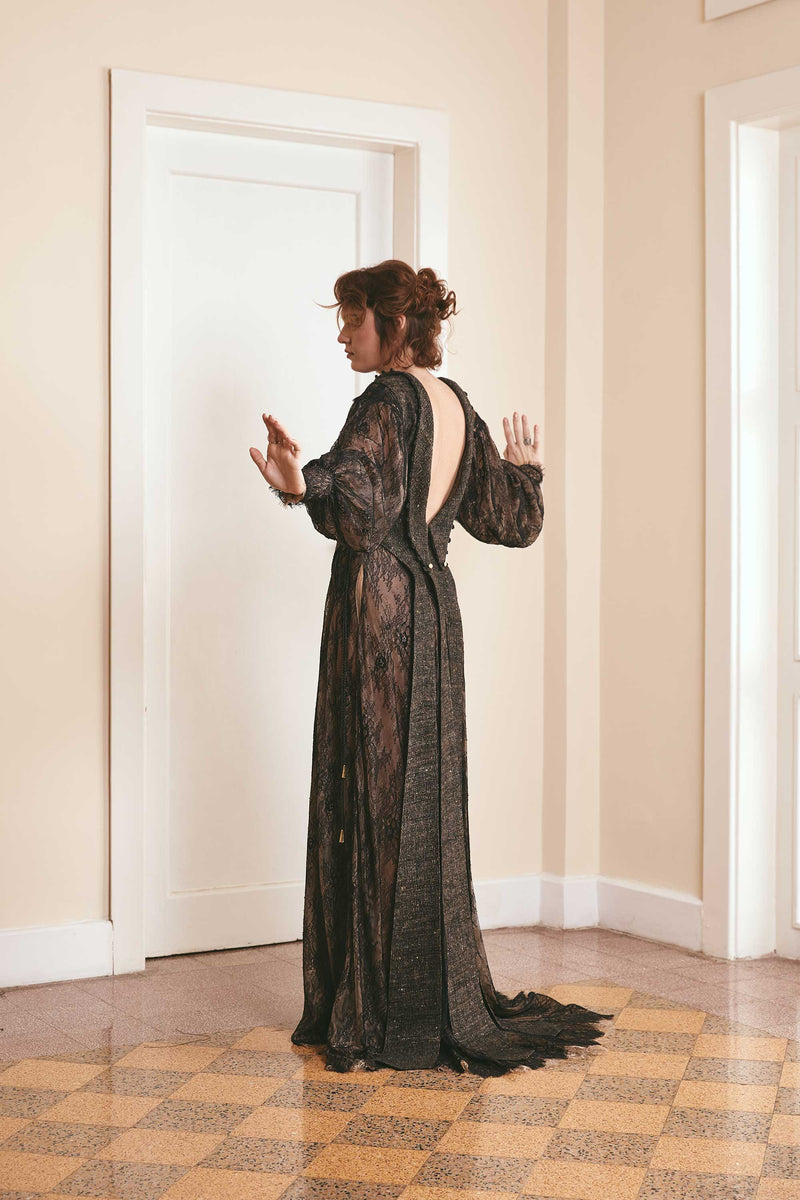 Black two-tone dress made of plain woven silk and lace, with long puffy sleeves and a backless style, ideal for fashion-forward women