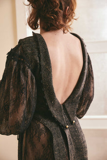 Black two-tone dress made of plain woven silk and lace, with long puffy sleeves and a backless style, ideal for fashion-forward women