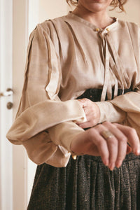 Hand-woven Muga silk top with wide sleeves and oversized fit, sourced from Assam, India. Perfect for fashion-forward ladies seeking unique and elegant evening outfits.